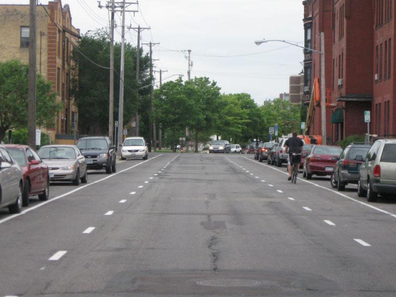 Advisory Bike Lanes are shown in Minneapolis, Minnesota, and are similar to those recently added on Edgewood Avenue on the border of Shorewood and Milwaukee. The ABL system requires cars to share a single traffic lane, merge into bike lanes to avoid collisions and yield to cyclists when merging.