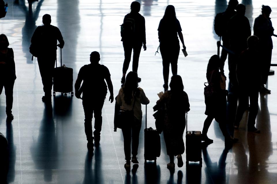 Travelers pass through Salt Lake City International Airport on June 27, 2022, in Salt Lake City.