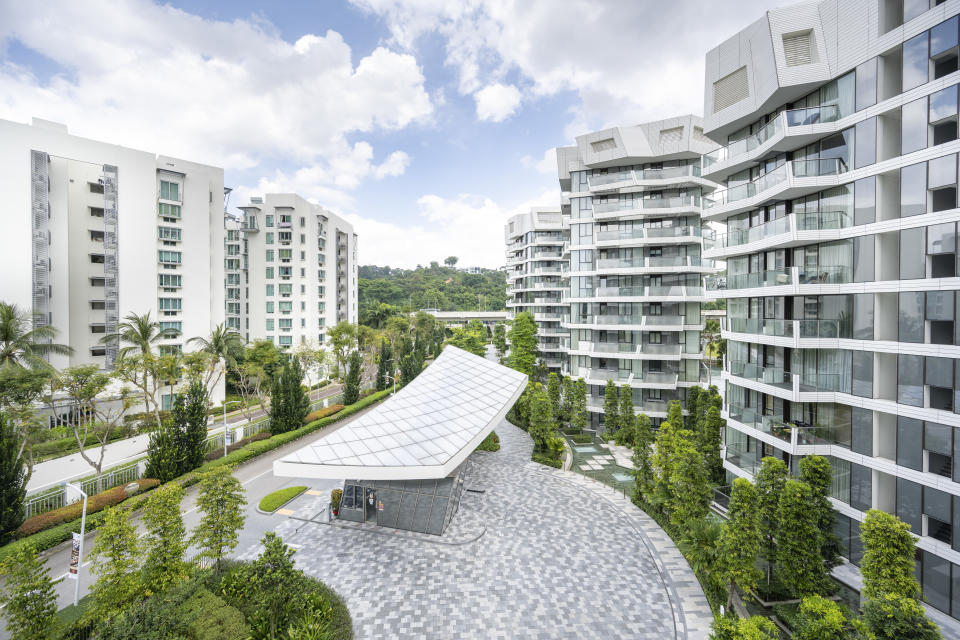 Super crowded but modern residential area in Singapore. People live in small compact smart home apartments close to the neighbour. This aerial view shows the Keppel Bay area in the southern tip of Singapore.