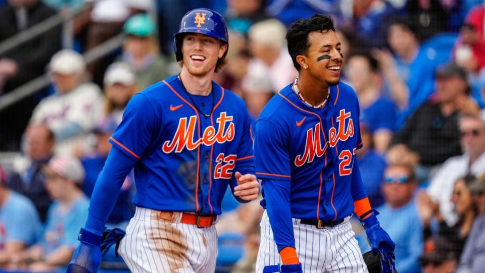 Mar 19, 2023;  Port St.  Lucie, Florida, USA;  New York Mets third baseman Brett Baty (22) and New York Mets first baseman Mark Vientos (27) walk back to the dugout after running home against the St.  Louis Cardinals during the first inning at Clover Park.