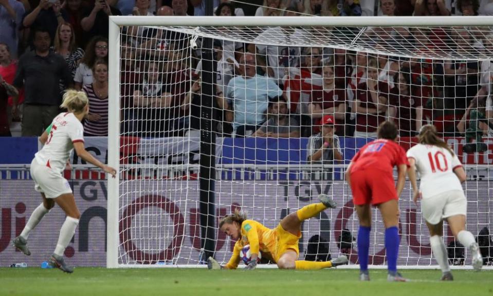 England captain Steph Houghton (left) sees her penalty saved by USA goalkeeper Alyssa Naeher.