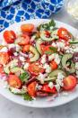 <p>Known as horiatiki, this traditional <a href="https://www.delish.com/uk/food-news/a30624859/greek-food/" rel="nofollow noopener" target="_blank" data-ylk="slk:Greek;elm:context_link;itc:0;sec:content-canvas" class="link ">Greek </a>salad is made with cherry tomatoes, cucumber, kalamata olives, thinly sliced red onion, and feta. The easy dressing is a mixture of red wine vinegar, fresh lemon juice, dried oregano, and extra-virgin olive oil. Simply said, it's the best. Especially considering this Mediterranean side dish only takes 15 minutes to prepare. </p><p>Get the <a href="https://www.delish.com/uk/cooking/recipes/a28839760/best-greek-salad-recipe/" rel="nofollow noopener" target="_blank" data-ylk="slk:Greek Salad;elm:context_link;itc:0;sec:content-canvas" class="link ">Greek Salad</a> recipe.</p>