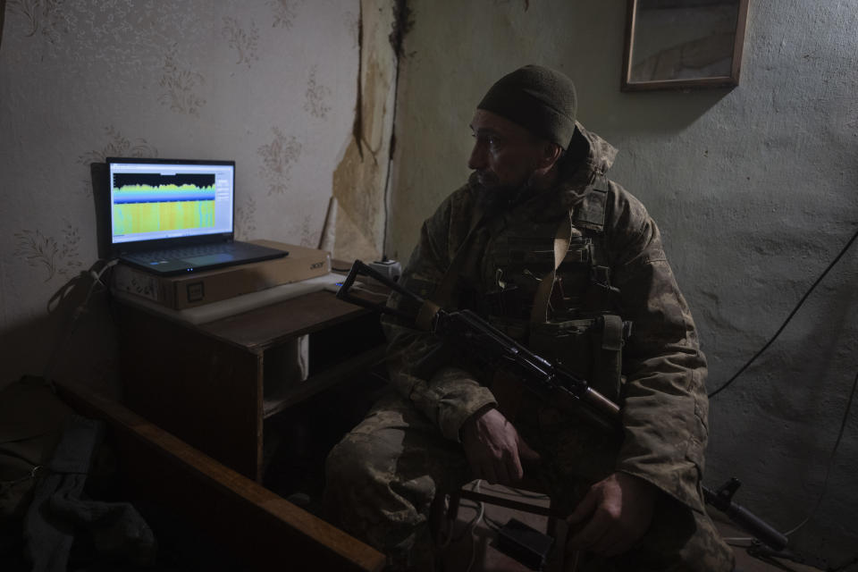 A Ukrainian soldier looks at a monitor of an electronic warfare system in a shelter to quell Russian drones at the front line, near Bakhmut, Donetsk region, Ukraine, Monday, Jan. 29, 2024. Ukrainian forces are increasingly resorting to an age-old tactic — intelligence gleaned from radio intercepts — in a desperate effort to preserve their most vital resources. The painstaking work of eavesdropping is part of a larger effort to beef up and refine electronic warfare capabilities so that soldiers can be warned earlier of impending attacks, while having the battlefield intelligence needed to make their own strikes more deadly. (AP Photo/Efrem Lukatsky)