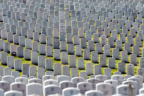 Rows of headstones stretch on at Arlington National Cemetery. The military says it will check all graves in the wake of a scandal over mislabeling and management problems. Full story