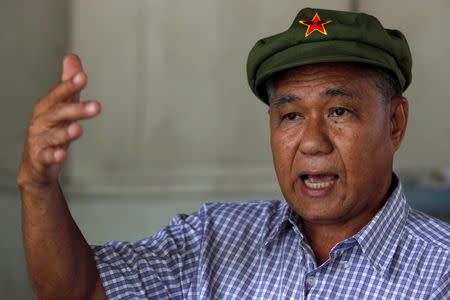 FILE PHOTO: Former communist and political prisoner Surachai Danwattananusorn gestures during an interview at his home in Bangkok, Thailand August 25, 2010. REUTERS/Chaiwat Subpransom/File Photo