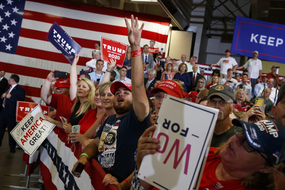 Supporters of President Donald Trump cheer as he arrives on stage at the Crown Expo for a campaign rally, Monday, Sept. 9, 2019, in Fayetteville, N.C. (AP Photo/Evan Vucci)