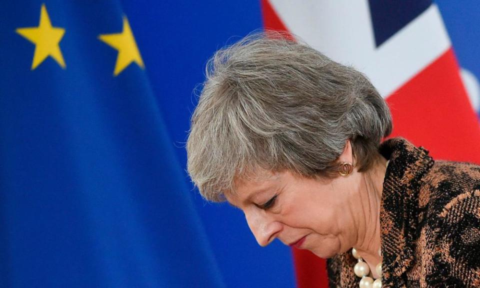 Theresa May leaves a press conference in Brussels on 14 December.