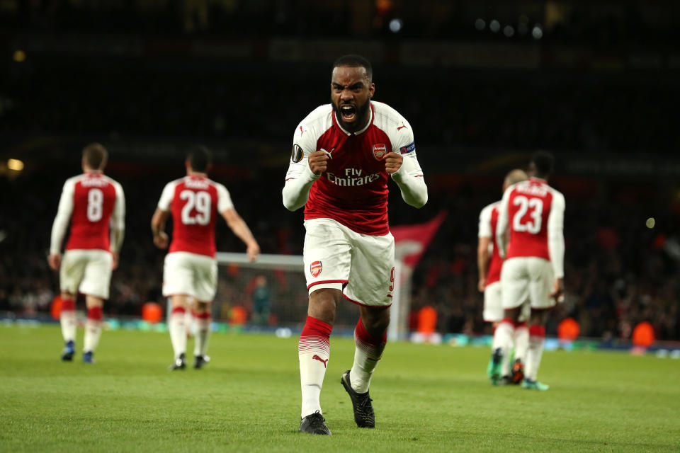 Alexandre Lacazette celebrates his goal against Atletico Madrid. (Photo by James Williamson – AMA/Getty Images)