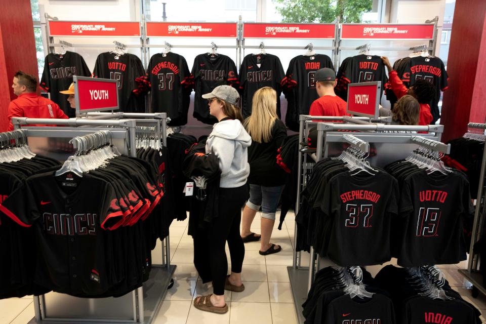 People look at the Nike Reds City Connect at the Reds Team Shop at Great American Ball Park in Cincinnati on Saturday, May 13, 2023. 