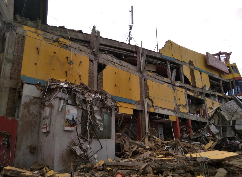 A department store building is seen heavily damaged by earthquake in Palu, Central Sulawesi, Indonesia, Saturday, Sept. 29, 2018. The powerful earthquake rocked the Indonesian island of Sulawesi on Friday, triggering a 3-meter-tall (10-foot-tall) tsunami that an official said swept away houses in at least two cities. (AP Photo/Rifki)