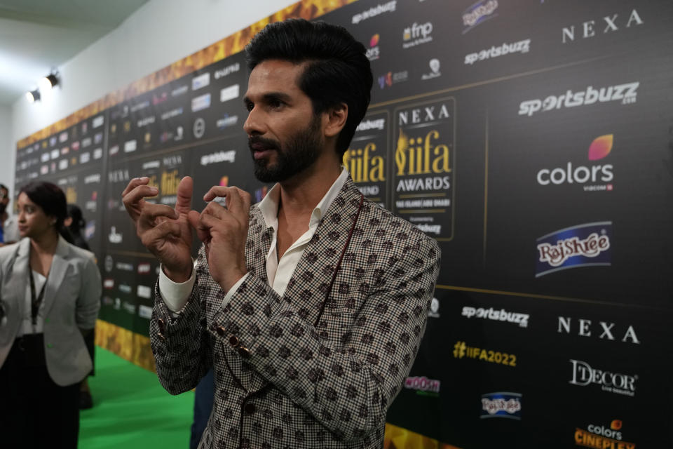 Indian actor Shahid Kapoor gestures as he poses on the green carpet ahead of the 22nd International Indian Film Academy (IIFA) awards in Abu Dhabi, United Arab Emirates, Friday, June 3, 2021. (AP Photo/Kamran Jebreili)