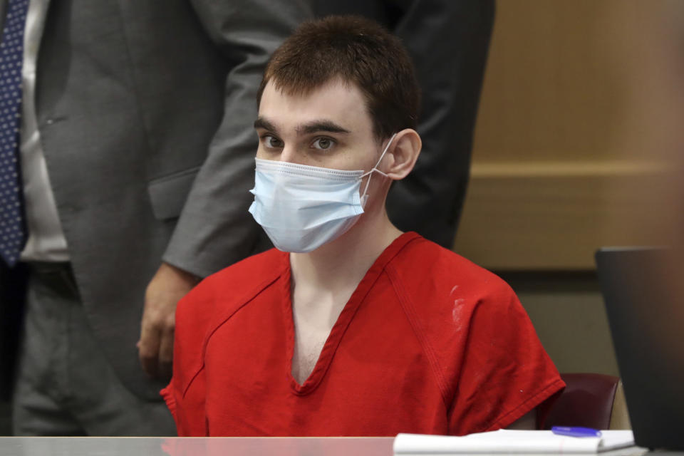 Parkland school shooter Nikolas Cruz sits in court during a pre-trial hearing at the Broward County Courthouse in Fort Lauderdale, Fla., Wednesday, July 14, 2021, on four criminal counts stemming from his alleged attack on a Broward jail guard in November 2018. Cruz is accused of punching Sgt. Ray Beltran, wrestling him to the ground and taking his stun gun. (Amy Beth Bennett/South Florida Sun-Sentinel via AP, Pool)