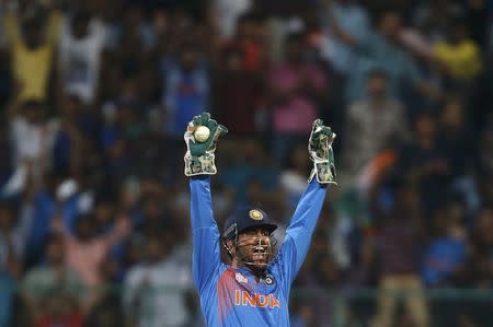 Cricket - India v Bangladesh - World Twenty20 cricket tournament - Bengaluru, India, 23/03/2016. India's captain and wicketkeeper Mahendra Singh Dhoni appeals unsuccessfully for the wicket of Bangladesh's Soumya Sarkar. REUTERS/Danish Siddiqui