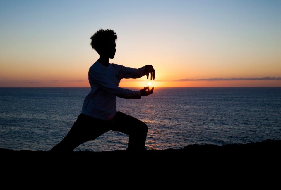 The meditative movements of tai chi work wonders to deescalate stress. Tamara Kulikova – stock.adobe.com