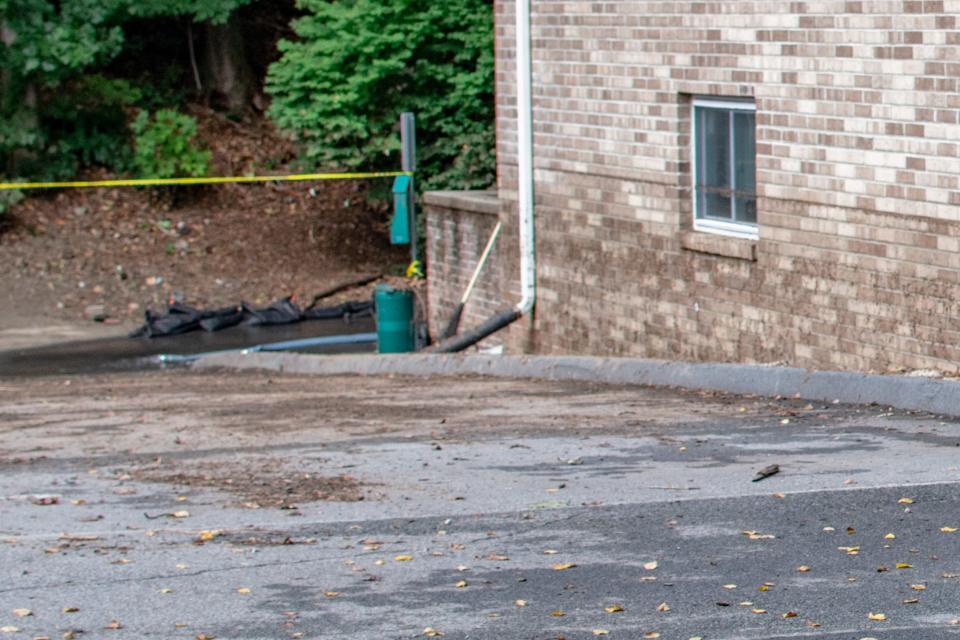 The high-water line is the mulch on the side of the building in this photo cropped to show detail on the water line.
