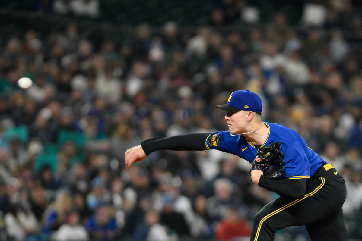 Seattle Mariners' Ty France removes his batting gear after