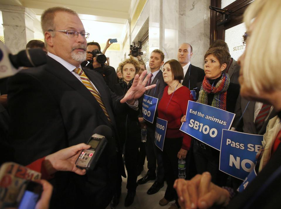 Utah Senator Stephen Urquhart, the author of Senate Bill 100, addresses LGBT rights activist in front of the Governor's office at the Utah State Capitol building, February 10, 2014, in Salt Lake City, Utah. LGBT rights activist are demanding the Legislature consider an anti-discrimination bill, Senate Bill 100, which the Senate has declined to do so. (REUTERS/Jim Urquhart)