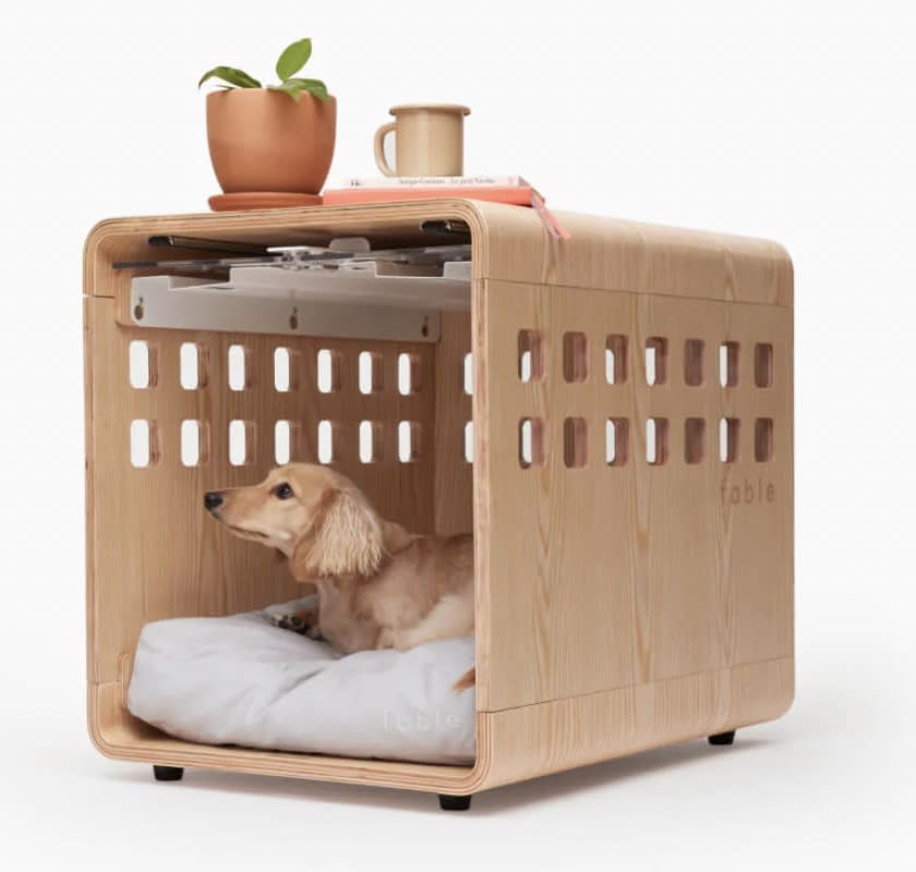 A wooden dog crate from Fable Pets.