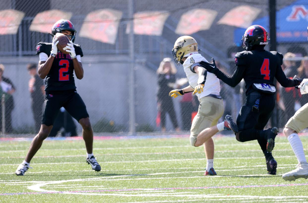 Monroe’s Messiah Hampton intercepts a pass and runs it back for a touchdown against DWC.