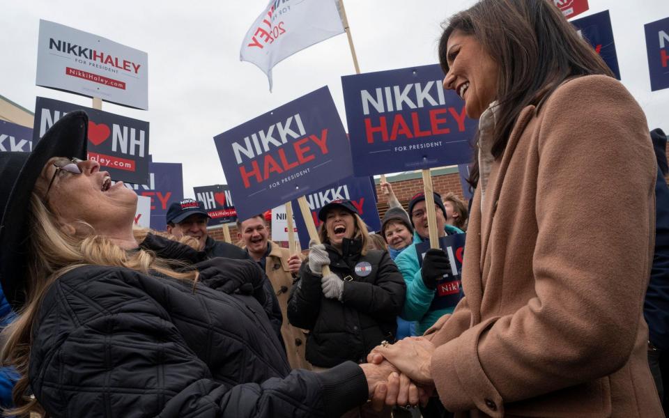 Ms Haley shares a joke with supporter Michelle Driscoll in Bedford