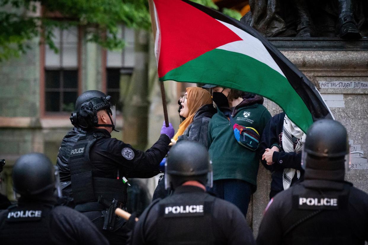 <span>In similar action, police clear protesters at the University of Pennsylvania campus in Philadelphia earlier this month.</span><span>Photograph: Jessica Griffin/AP</span>