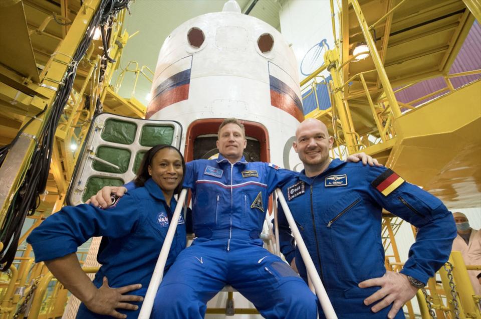 Jeanette Epps, seen with her former crewmates Sergey Prokopyev (at center) and Alexander Gerst in December 2017 at the Baikonur Cosmodrome in Kazakhstan. <cite>Andrey Shelepin/GCTC via NASA</cite>
