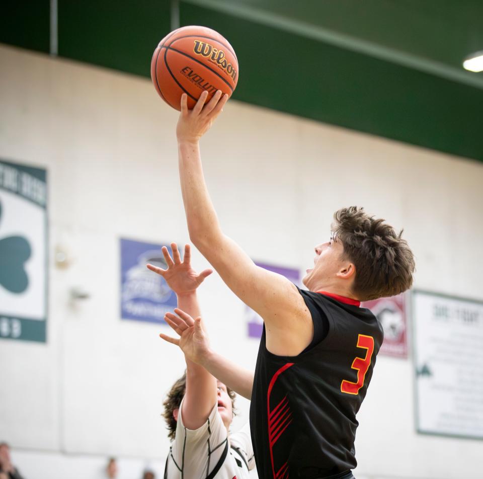 North Eugene guard Joey Banry goes up for a shot as the North Eugene Highlanders host North Medford Friday, Dec. 8, 2023, at Sheldon High School in Eugene.