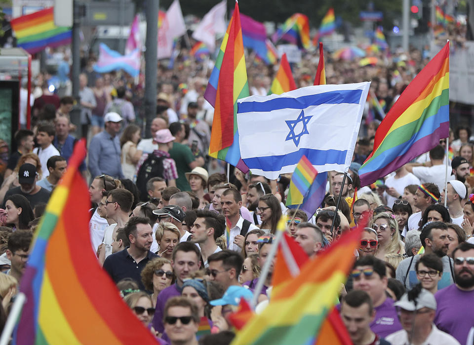 People take part in a gay pride parade in Warsaw, Poland, on Saturday, June 8, 2019. The Equality Parade is the largest gay pride parade in central and Eastern Europe. It brought thousands of people to the streets of Warsaw at a time when the LGBT rights movement in Poland is targeted by hate speeches and a government campaign depicting it as a threat to families and society. (AP Photo/Czarek Sokolowski)