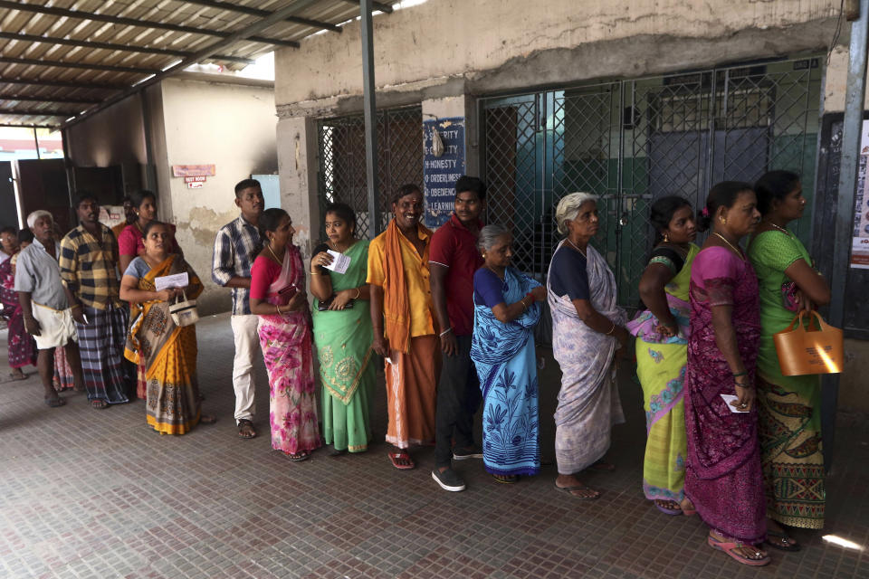 Indians stand in a queue to cast their votes during the second phase of India's general elections in Chennai, India, Thursday, April 18, 2019. The Indian election is taking place in seven phases over six weeks in the country of 1.3 billion people. Some 900 million people are registered to vote for candidates to fill 543 seats in India's lower house of Parliament. (AP Photo/R. Parthibhan)