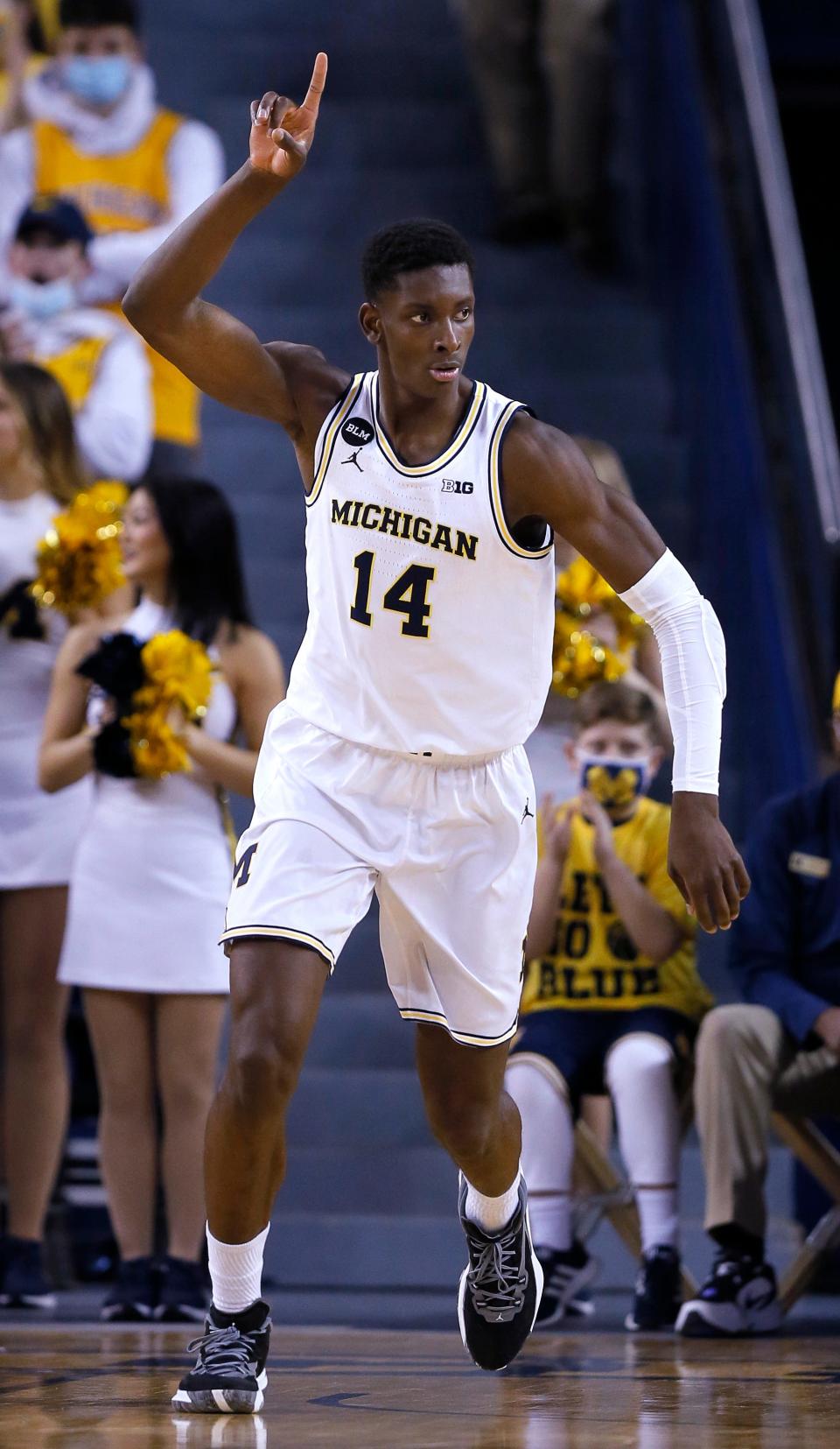 Michigan forward Moussa Diabate celebrates after scoring against Nebraska during the first half of an NCAA college basketball game Tuesday, Feb. 1, 2022, in Ann Arbor, Mich. Michigan won 85-79.