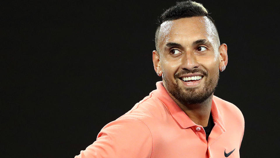 Nick Kyrgios is pictured smiling during the 2020 Australian Open.