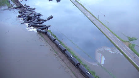 Tanker cars from a freight train carrying crude oil are shown after a derailment along the Rock River south of Doon, Iowa. Sioux County Sheriff's Office/via REUTERS