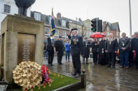 <p>A member of the Royal British Legion salutes after laying a wreath at the war memorial during a service of remembrance at Royal Wootton Bassett, Wiltshire, England on Nov.11, 2017. (Photo: Ben Birchall/PA Images via Getty Images) </p>