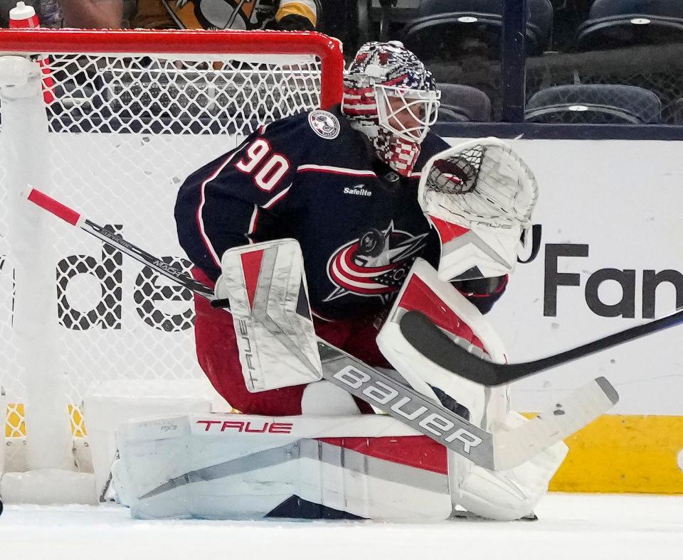 Sept. 24, 2023; Columbus, Oh., USA; Columbus Blue Jackets goaltender Elvis Merzlikins (90) takes a puck to the chest during the first period of Sunday's hockey game against the Pittsburgh Penguins at Nationwide Arena.