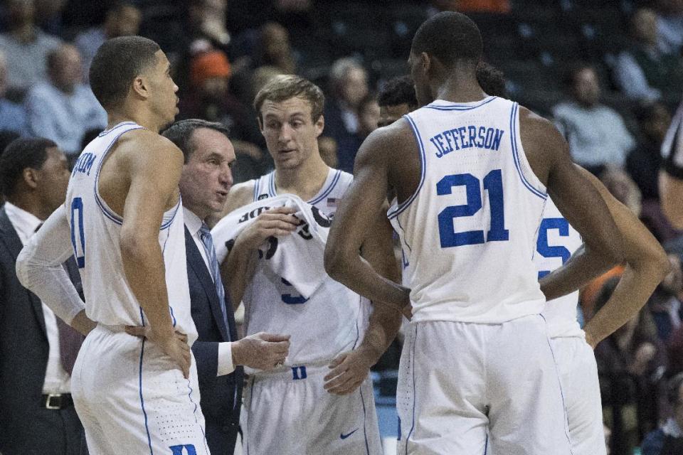 Duke head coach Mike Krzyzewski, second from left, gives his team instruction during a time out in the second half of an NCAA college basketball game against the Clemson in the Atlantic Coast Conference tournament, Wednesday, March 8, 2017, in New York. Duke won 79-72. (AP Photo/Mary Altaffer)