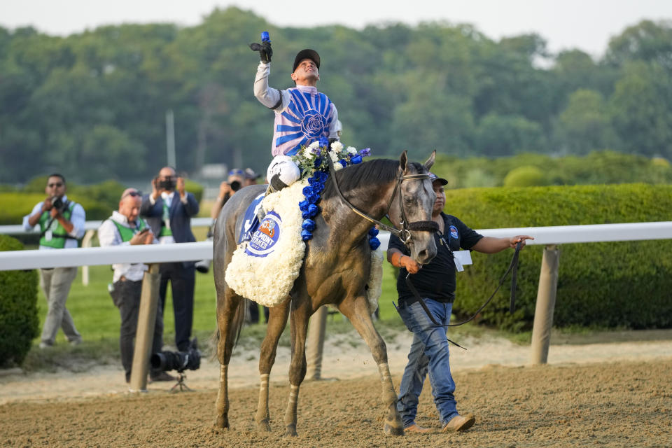 Jockey Javier Castellano celebrates aboard Arcangelo after winning the 155th running of the Belmont Stakes horse race, Saturday, June 10, 2023, at Belmont Park in Elmont, N.Y. (AP Photo/Mary Altaffer)