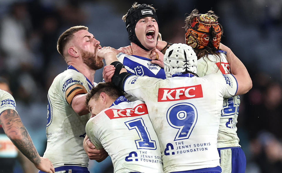 Matt Burton, pictured here celebrating with Bulldogs teammates.