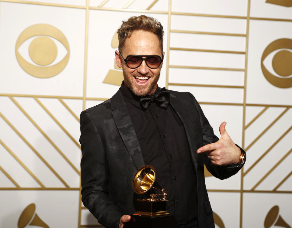 Tobymac holds the award for Best Contemporary Christian Music Album for "This Is Not A Test" during the 58th Grammy Awards in Los Angeles, California February 15, 2016.  REUTERS/Lucy Nicholson