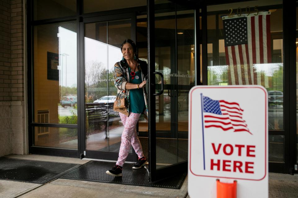 Tenie Casto, of Lancaster, walks out the door after casting her ballot in the local city election on May 2, 2023, at Crossroads Ministry Center in Lancaster, Ohio. Voters will go to the polls again on Nov. 7.