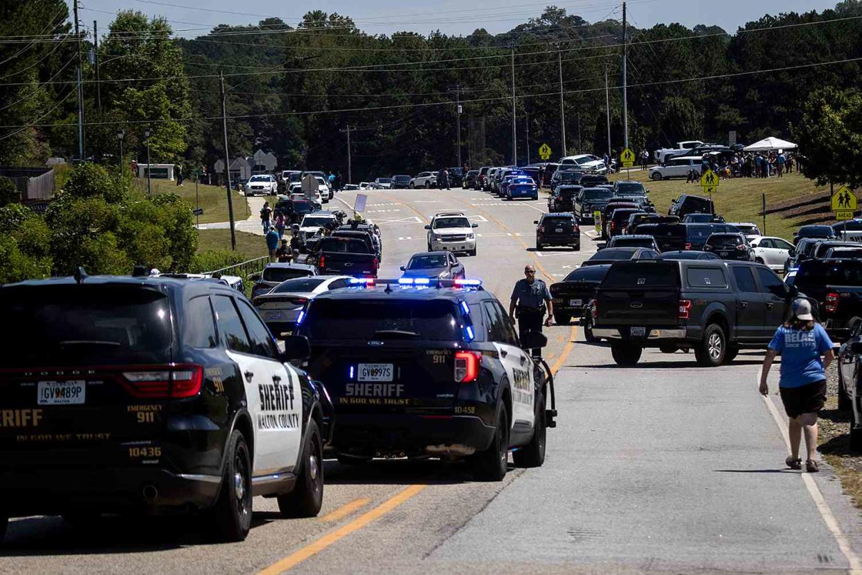 <p>CHRISTIAN MONTERROSA/AFP via Getty</p> Law enforcement and first responders control traffic after a shooting took place at Apalachee High School in Winder, Georgia, on Sept. 4