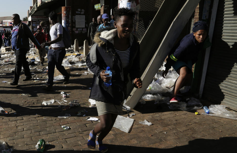 A store in Germiston, is looted, east of Johannesburg, South Africa, Tuesday, Sept. 3, 2019. Police had earlier fired rubber bullets as they struggled to stop looters who targeted businesses as unrest broke out in several spots in and around the city. (AP Photo/Themba Hadebe)
