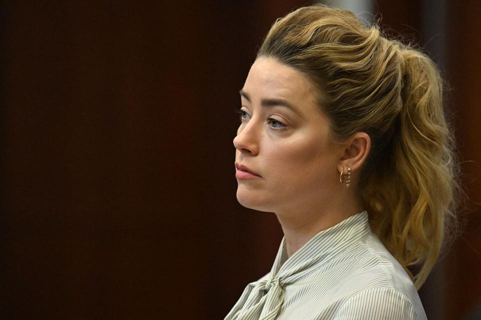 US actress Amber Heard attends trial at the Fairfax County Circuit Courthouse in Fairfax, Virginia, on April 19, 2022. - US actor Johnny Depp is suing ex-wife Heard for libel after she wrote an op-ed piece in The Washington Post in 2018 referring to herself as a public figure representing domestic abuse.