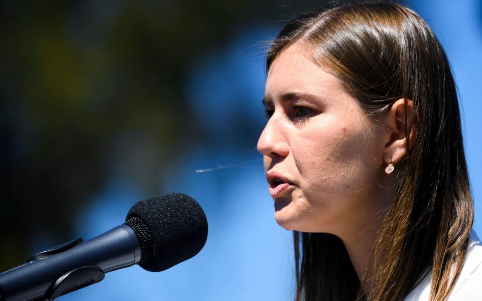 Former Liberal staffer Brittany Higgins speaks as she attends the Women's March 4 Justice in Canberra, Monday, March 15, 2021. Higgins said she felt she had to make a choice between reporting her allegations to police or continuing her career. She quit her government job in January and reported her allegation to police. (Lukas Coch/AAP Image via AP) - Lukas Coch/AAP Image via AP