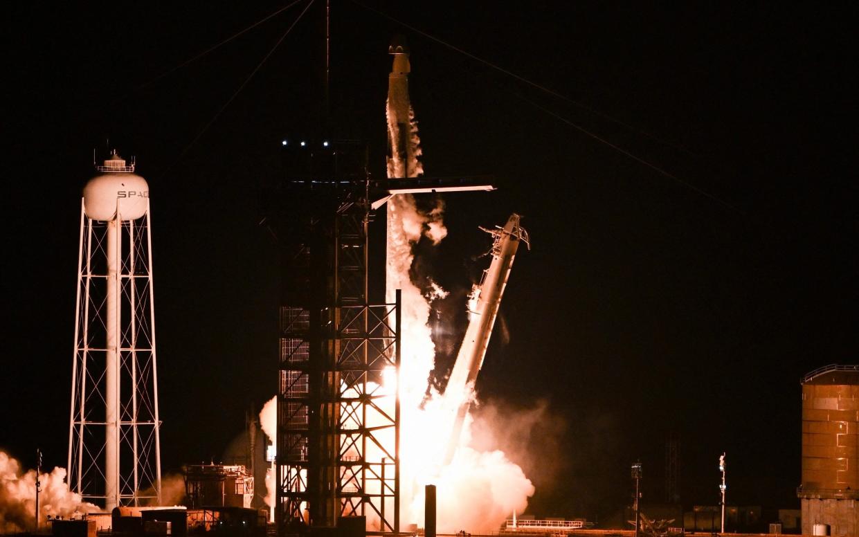 A SpaceX Falcon 9 rocket with the Crew Dragon Resilience capsule, carrying the crew of the Polaris Dawn Mission, lifts off from Launch Complex