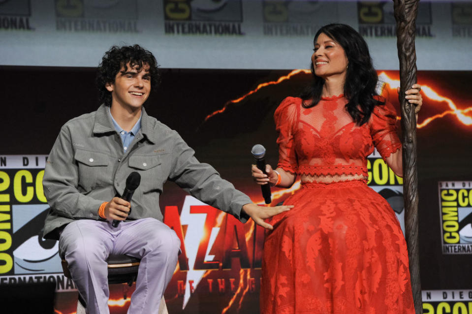 Jack Dylan Grazer and Lucy Liu speak onstage at the Warner Bros. theatrical panel