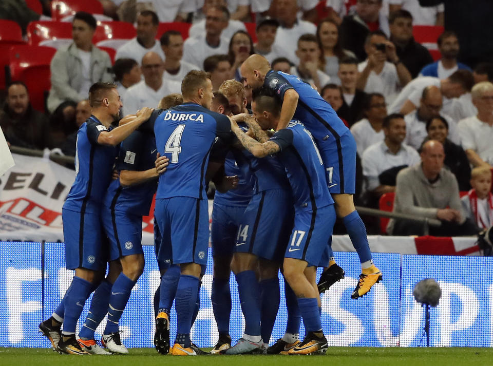 <p>CORRECTS PHOTOGRAPHERS NAME TO FRANK AUGSTEIN Slovakia’s players celebrate the opening goal during the World Cup Group F qualifying soccer match between England and Slovakia at the Wembley stadium in London, Great Britain, Monday, Sept. 4, 2017. (AP Photo/Frank Augstein) </p>