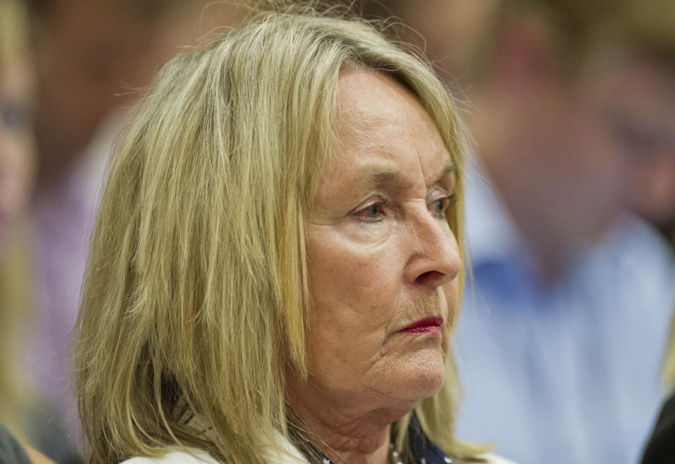 June Steenkamp, mother of the late Reeva Steenkamp, listens in the public gallery, as state prosecutor Gerrie Nel questions Oscar Pistorius, in court in Pretoria, South Africa, Friday, April 11, 2014. Pistorius is charged with the murder of his girlfriend Reeva Steenkamp, on Valentines Day in 2013. (AP Photo/Craig Nieuwenhuizen, Pool)