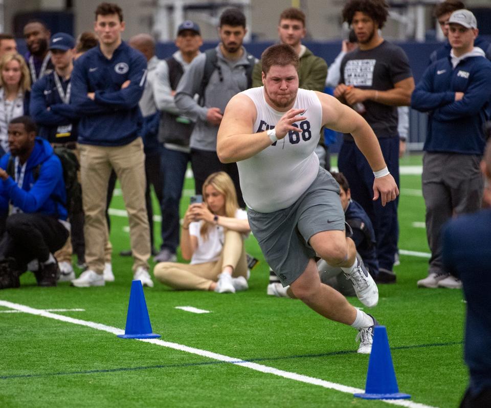 Eric Wilson runs a three-cone-drill during Penn State Pro Day in Holuba Hall in State College.