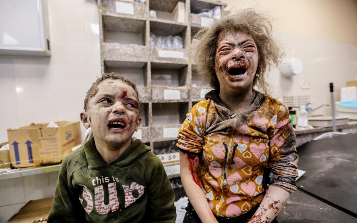 Young children injured in Israeli airstrikes arrive at Nasser Medical Hospital on December 3