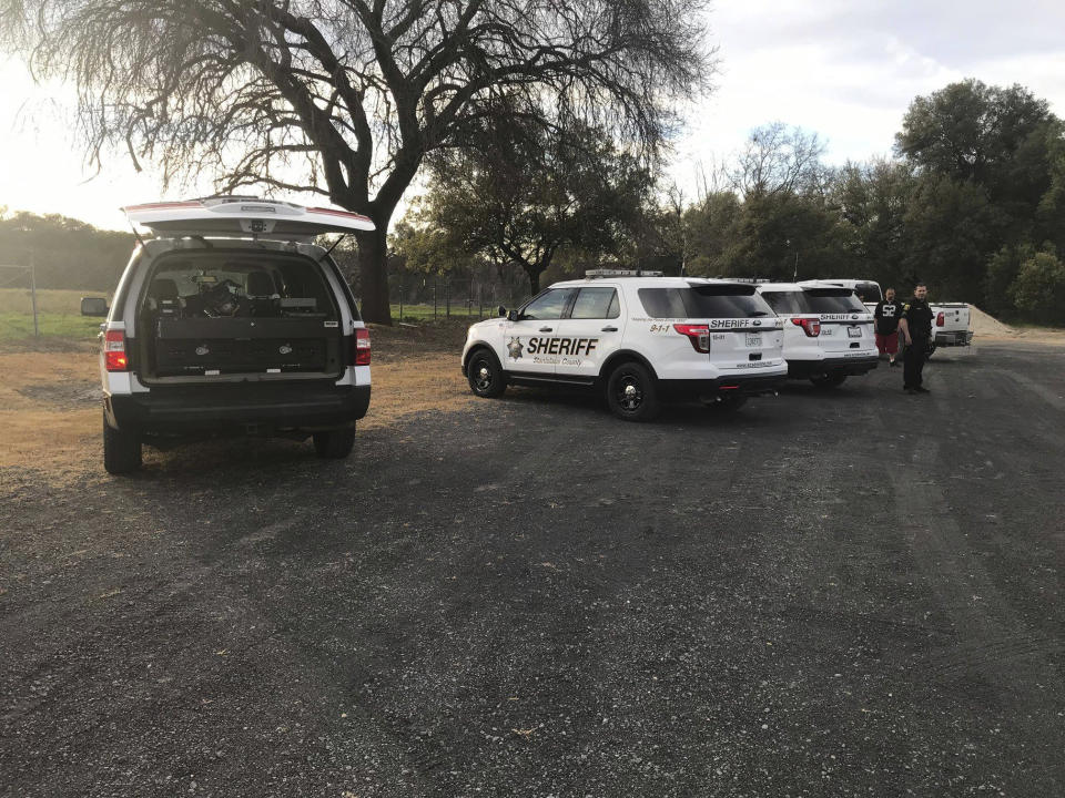 In this Sunday, March 17, 2019 photo provided by the Stanislaus Consolidated Fire Protection District Authorities fire and rescue personnel search for a 5-year-old girl who was swept away by a swollen river in Central California. The Stanislaus Sheriff's Department said the girl slipped off rocks and fell into the Stanislaus River Sunday afternoon. The department said several relatives and bystanders tried to rescue her but couldn't reach her. The department said in a statement crews on boat and a helicopter searched until darkness Sunday but called off their search because of the river's dangerous conditions. (Stanislaus Consolidated Fire Protection District via AP)